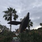 The 'Breaching Whale' sculpture by Jon Seeman at Heisler Park – A landmark of public art and coastal preservation in Laguna Beach, CA. Home of the 2026 Sunset Serenades free concert series in Laguna Beach.