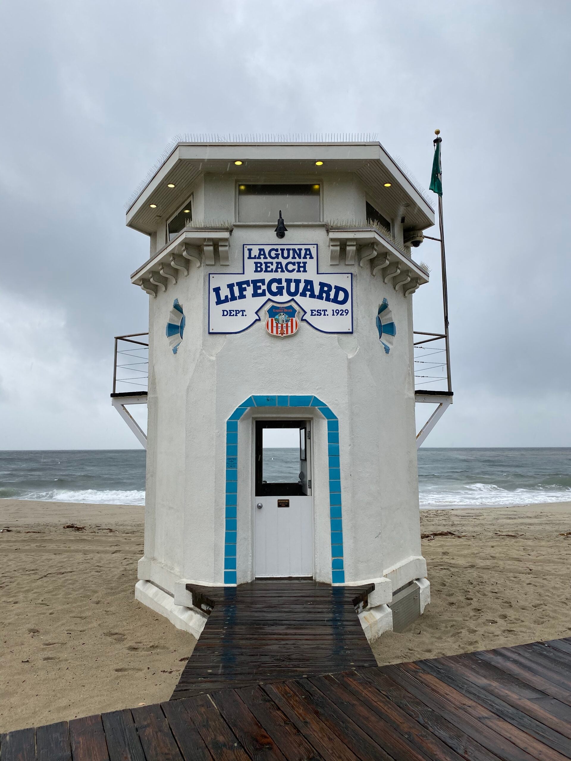 The iconic white hexagonal Lifeguard Tower at Main Beach in Laguna Beach – A symbol of community-led preservation and the #solaguna standard.