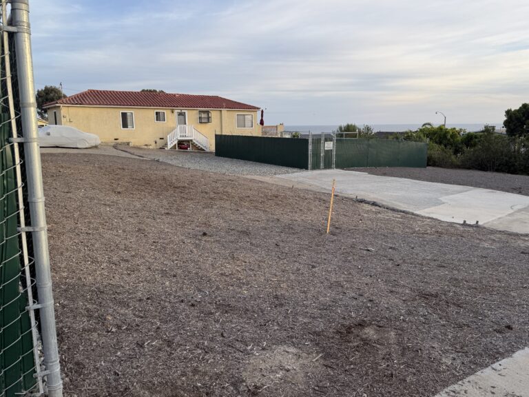 Street view of the derelict SCWD site at 31762 Coast Hwy in South Laguna, showing a dirt lot, chain link fence, and unmaintained structures, April 20, 2026. Non-compliant with CUP and CEQA requirements.