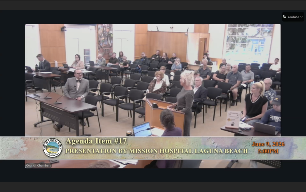 Laguna Beach resident standing at the podium delivering public comment on the hospital emergency room to the City Council