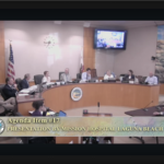 Providence Mission Hospital CEO Seth Tegan speaking at the podium to the Laguna Beach City Council during Item 18