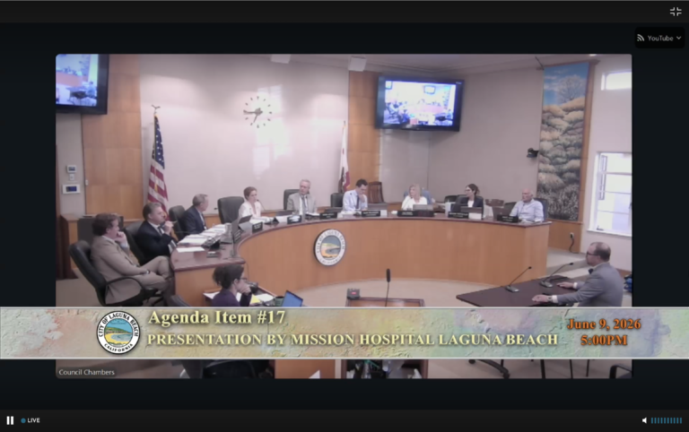 Providence Mission Hospital CEO Seth Tegan speaking at the podium to the Laguna Beach City Council during Item 18